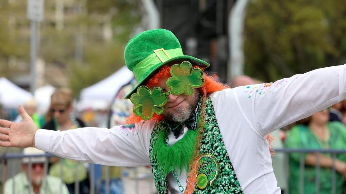 A festive parade walker smiles for the camera as the 39th annual Hibernia St. Patrick’s Day parade rolls through downtown Biloxi on Saturday, March 11, 2017.