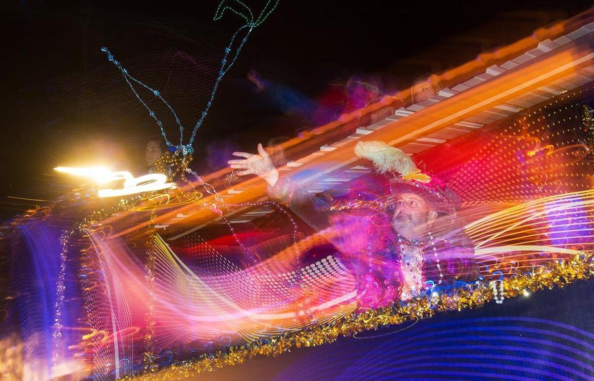A member of the Gulf Coast Carnival Association court throws beads while parading to the Mardi Gras Museum on Jan. 5, 2015, in celebration of Twelfth Night. The holiday lights were turned off at the Biloxi Lighthouse and then turned on at the Mardi Gras Museum to symbolize the start of Mardi Gras season. This year’s celebration is Friday, Jan. 5, starting at the Biloxi Visitors Center.