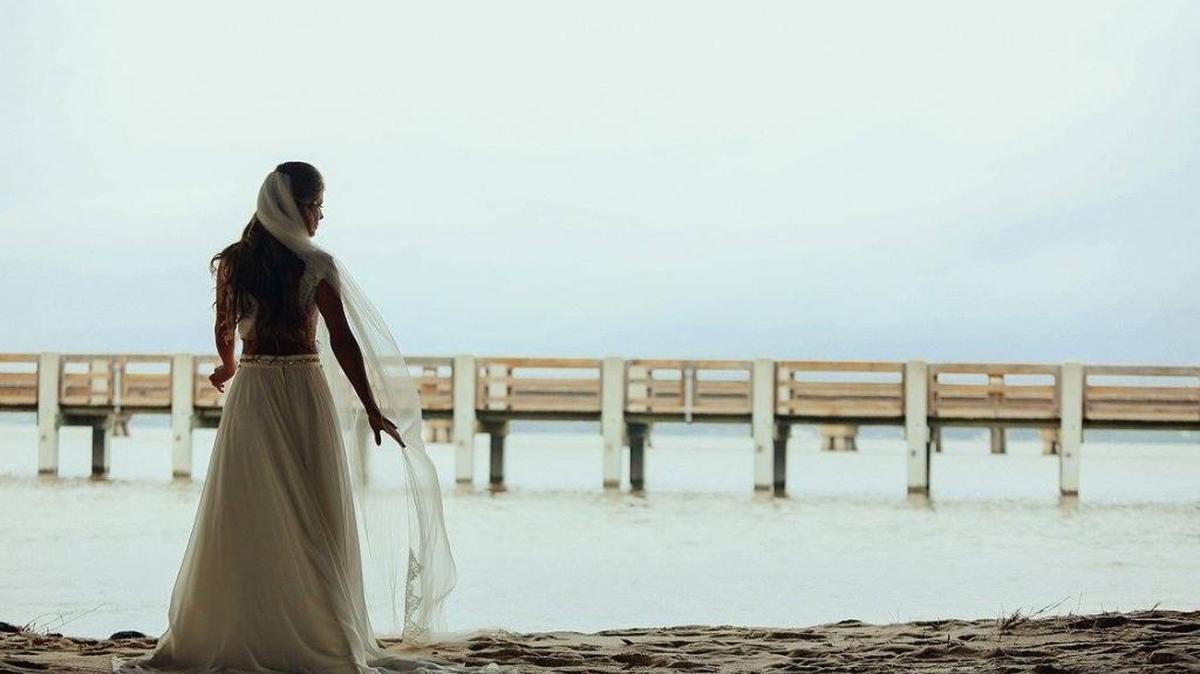 Kaylee Salazar poses in Ocean Springs on her wedding day.