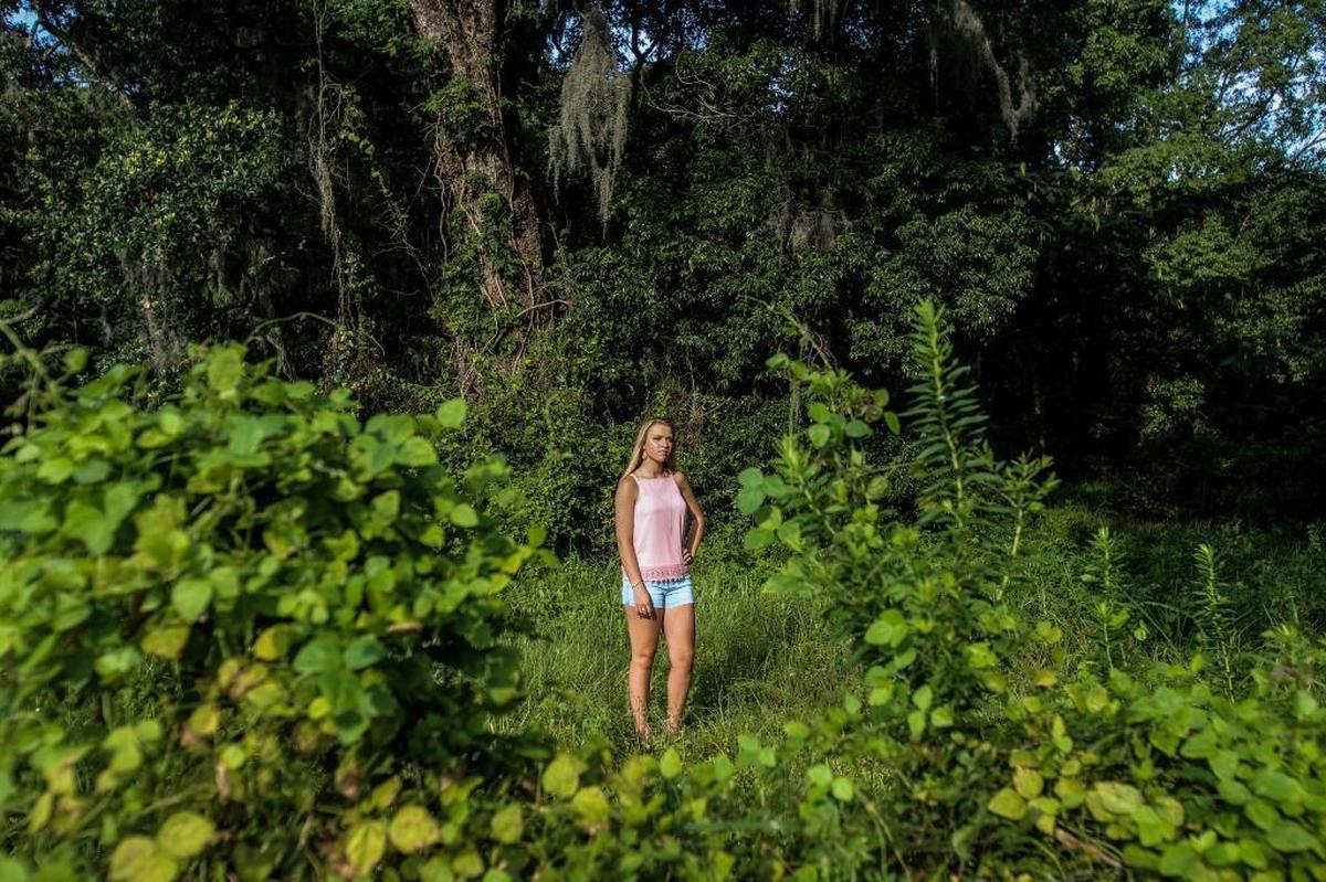 An overgrown lot across from the Biloxi - Ocean Springs bridge and Ocean Springs yacht club is a great spot for senior photography and bridal portraits.