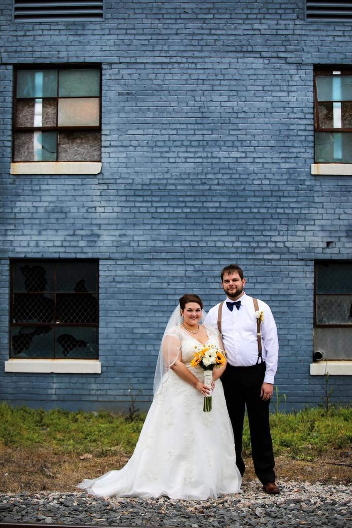 Old, uninhabited buildings in downtown Gulfport are the perfect spots for bridal photography.