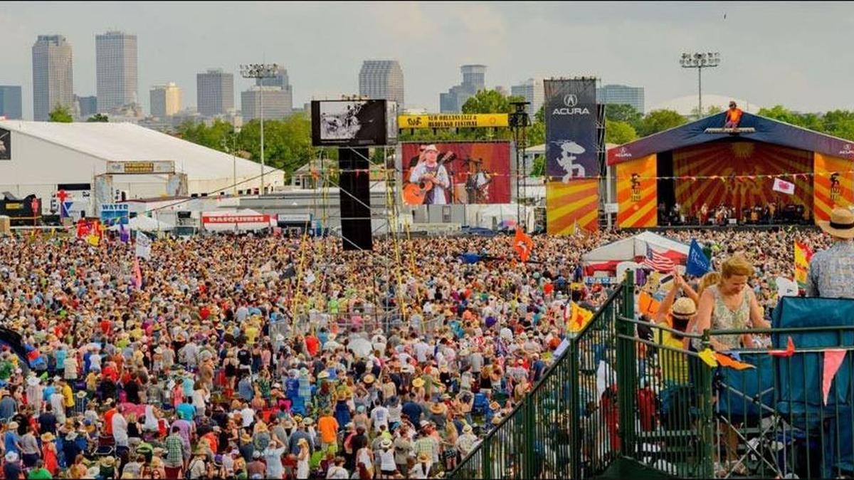 A crowd stands in front of the Acrua Stage at Jazz Fest during Paul Simon’s performance in 2016.