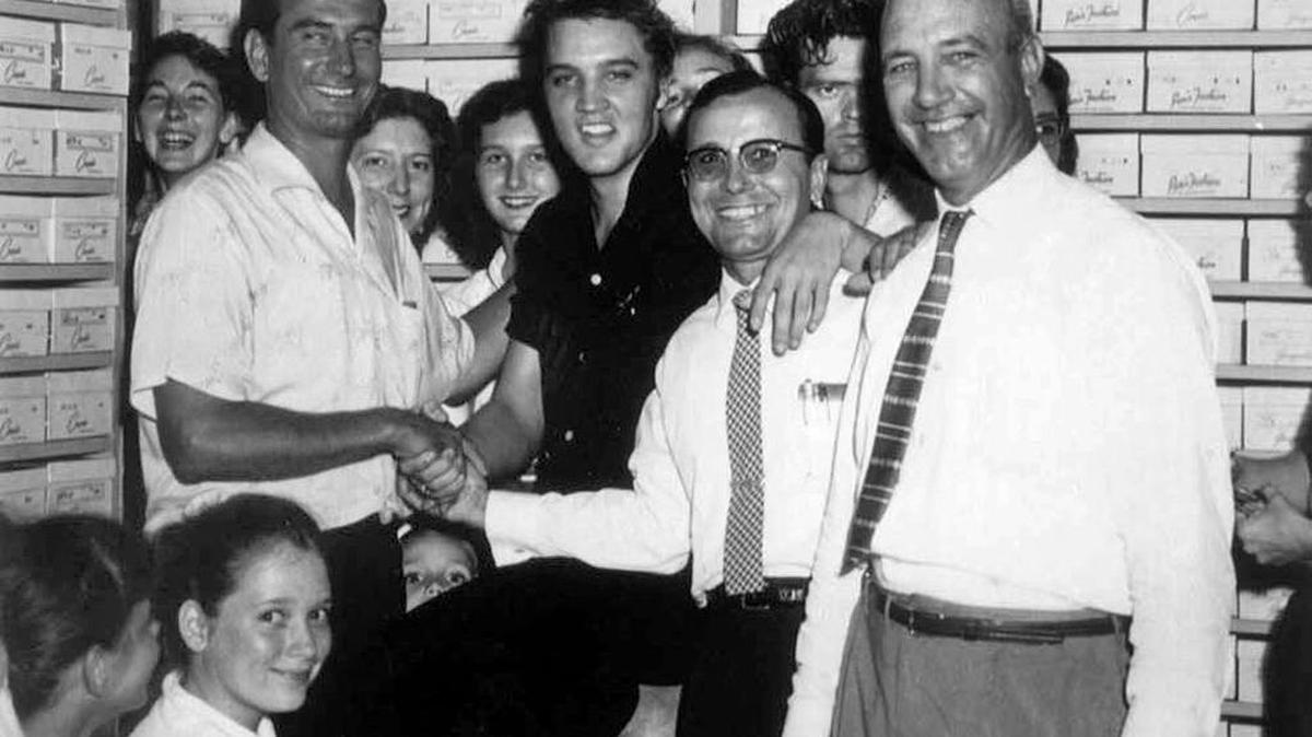 Elvis Presley is photographed with Eddie Bellman and the employees of his shoe store on Howard Avenue in Biloxi in 1956. The Pascagoula Public Library will celebrate Elvis’ 83rd birthday on Jan. 9 with a movie and Elvis-themed snacks. Patrons also are encouraged to dress as the ‘king of rock ‘n’ roll.’