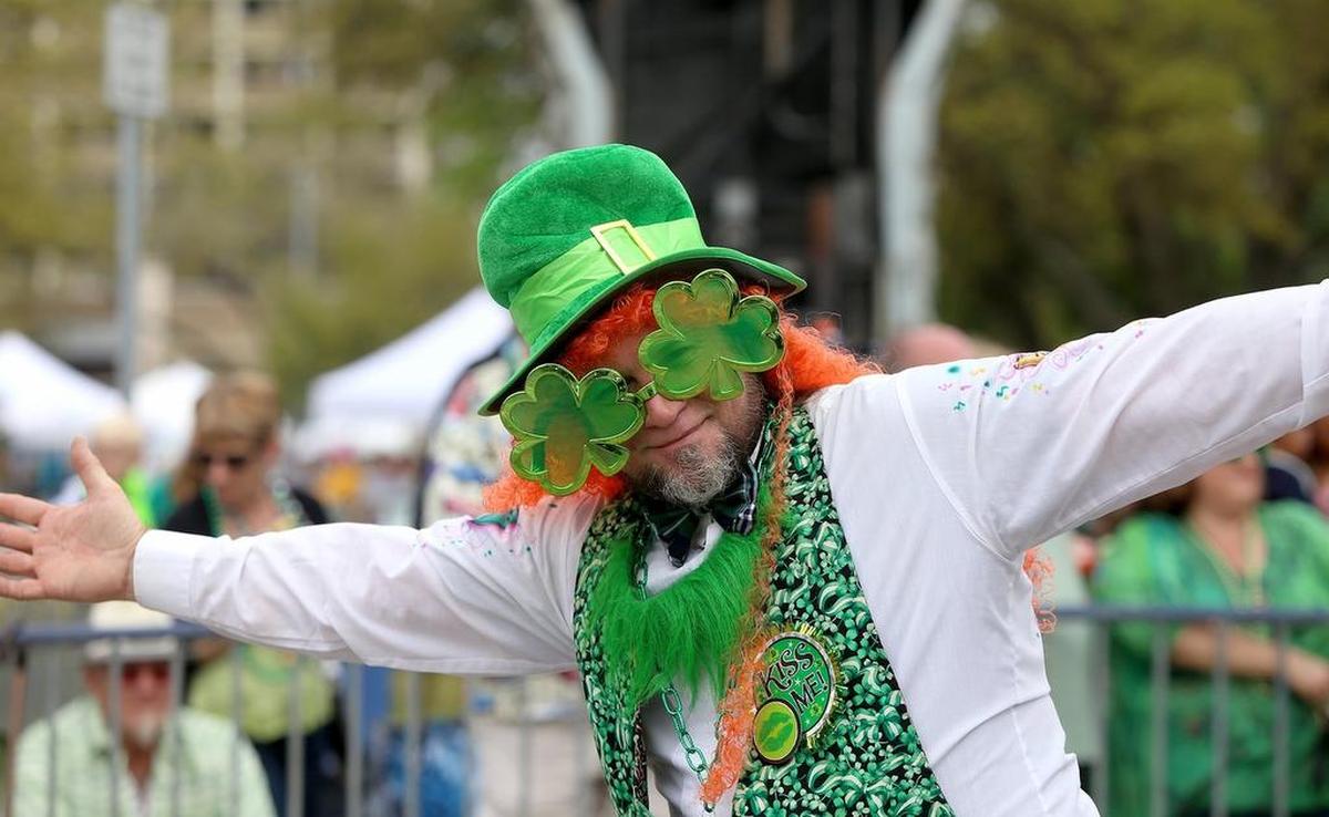 A festive parade walker smiles for the camera as the 39th annual Hibernia St. Patrick’s Day parade rolls through downtown Biloxi in 2017.