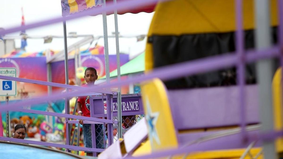 A young boy waits his turn to ride the Tilt-A-Whirl at the 31st annual South Mississippi Summer Fair in 2017, at the grounds of the Mississippi Coast Coliseum & Convention Center. This year’s event starts Thursday.