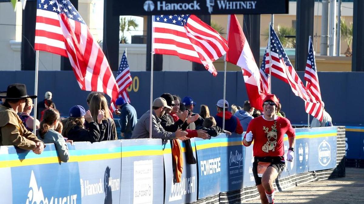 Runners race past U. S. and Canadian flags as they near the finish line at the 2016 Mississippi Gulf Coast Marathon. This year’s Mississippi Gulf Coast Marathon starts 7 a.m. Dec. 10 at Henderson Point, Pass Christian, and ends at Jones Park in Gulfport. The Marathon Expo is Dec. 8 and 9 at MGM Park in Biloxi, with the kids marathon on Dec. 9.