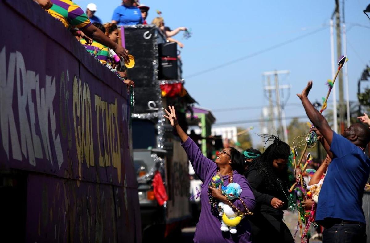 Paradegoers yell for throws as the St. Paul Carnival Association parade rolls through downtown Pass Christian on Sunday, February 26, 2017. ‘Pass Beyond Galaxies: An Outer Space Adventure’ was this year’s theme.