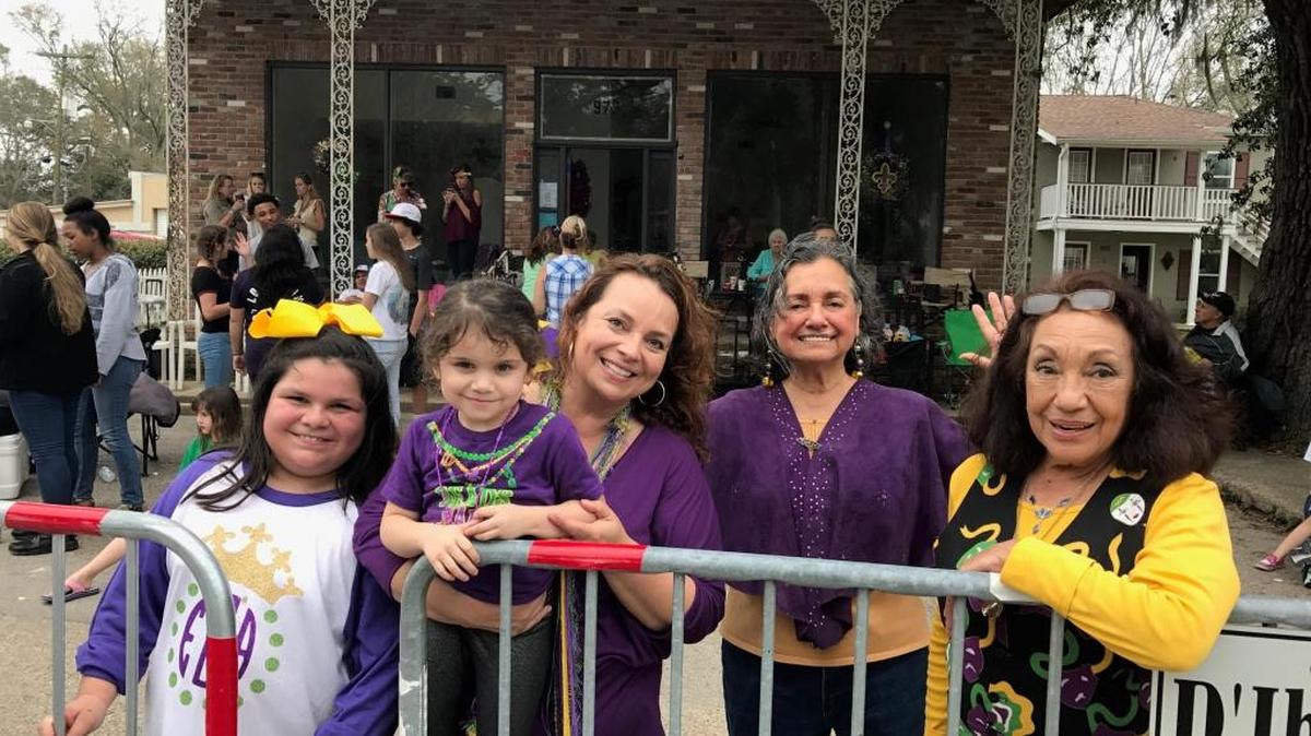 Margaret Ann Rouse, center, enjoys her annual Mardi Gras party with her daughters, Elva and Analicia, mother Elva O’Brian and aunt Viena Rouse on Howard Avenue in Biloxi on Tuesday, Feb. 28, 2017.
