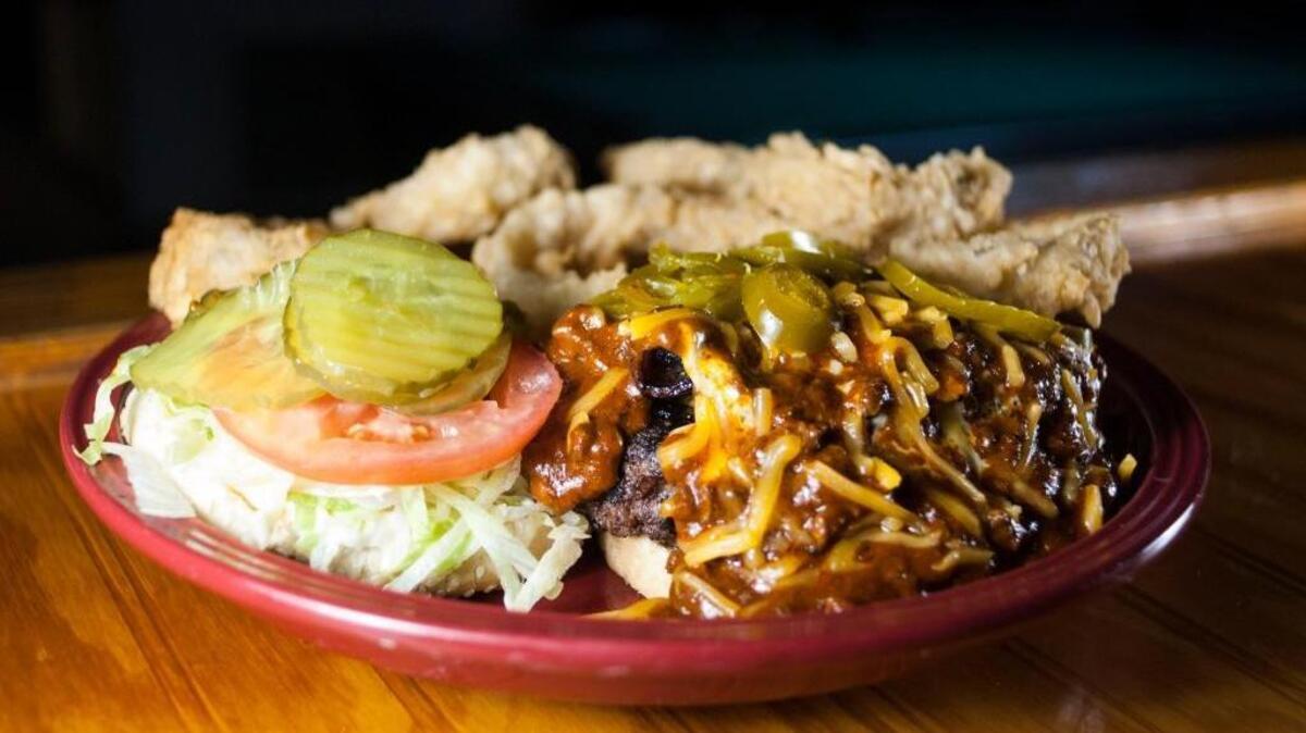 The Grand Slam Burger served at Third Base in Bay St. Louis is loaded with chilli, bacon, cheese and more.
