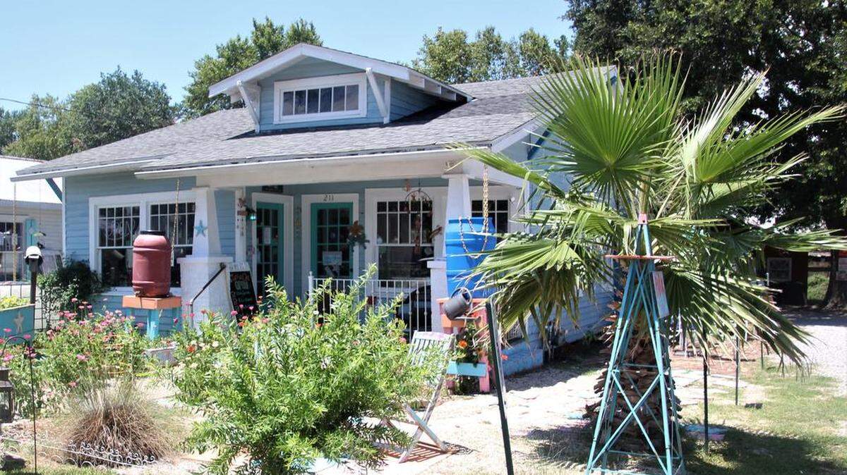 There are lots of flowers and vegetables in the front yard of the Starfish Cafe in Bay St. Louis.