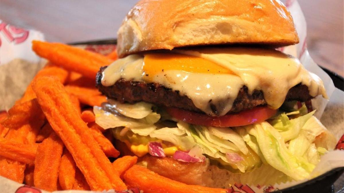 Da Big Cheese has three kinds of cheese and takes two hands to eat.
