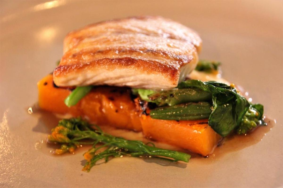 Seabass with grilled butternut squash and blooming Napa cabbage from Vestige in Ocean Springs.