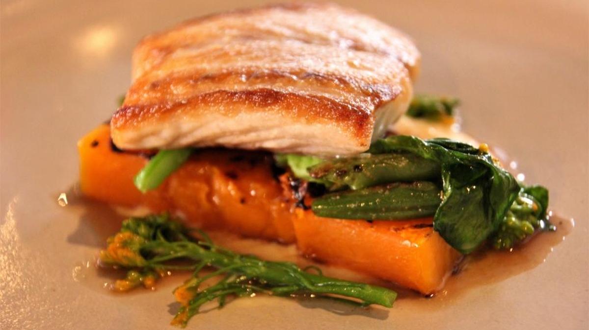 Seabass with grilled butternut squash and blooming Napa cabbage from Vestige in Ocean Springs.