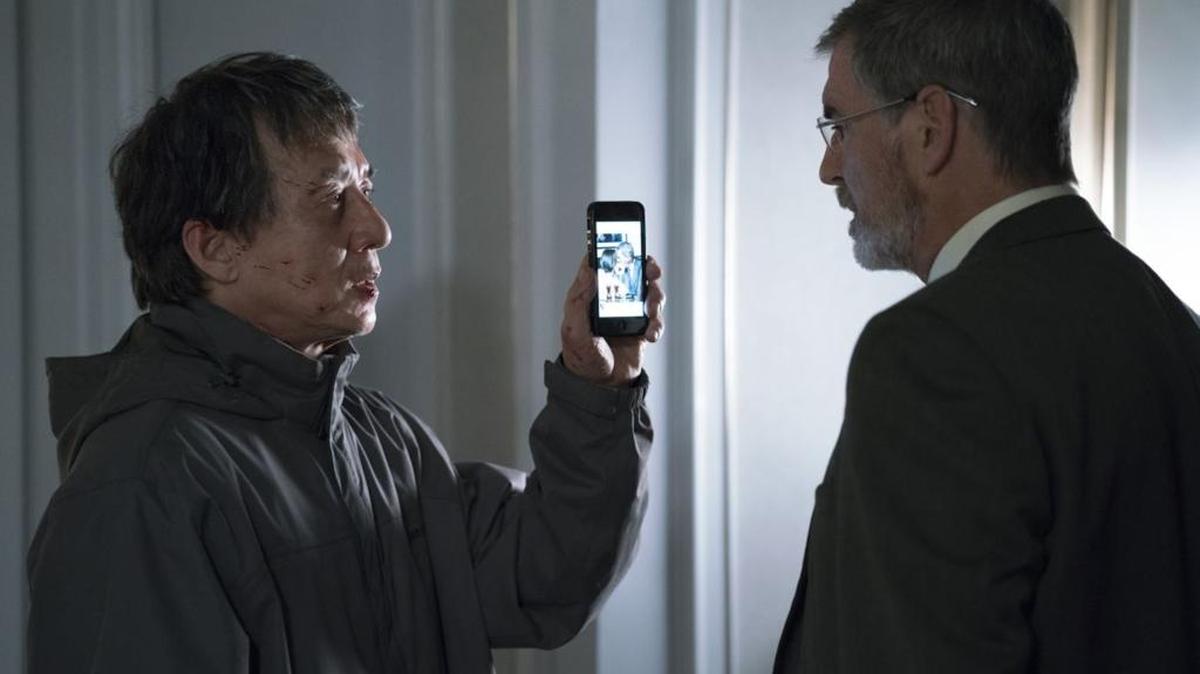 Jackie Chan as Quan and Pierce Brosnan as Hennessy in hotel suite in ‘The Foreigner.’