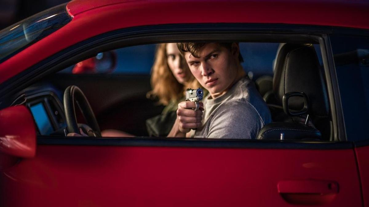 Baby (Ansel Elgort) and Debora (Lily James) jack a car to get away in ‘Baby Driver.’
