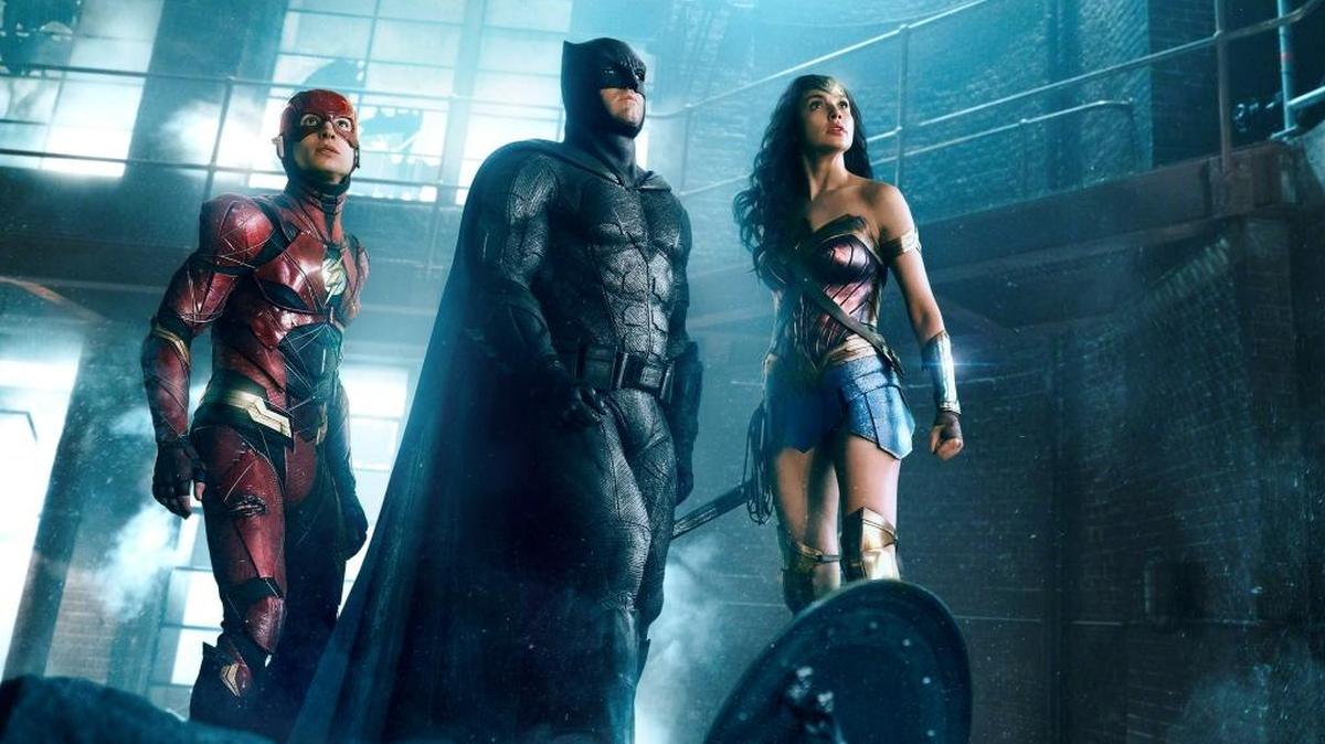 Ezra Miller as The Flash, Ben Affleck as Batman and Gal Gadot as Wonder Woman in the film ‘Justice League.’