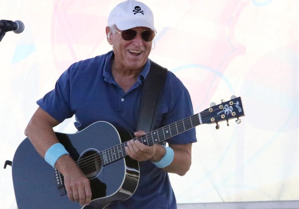Jimmy Buffett performs on the beach in Pascagoula during a ceremony dedicating a bridge in his honor in 2015.