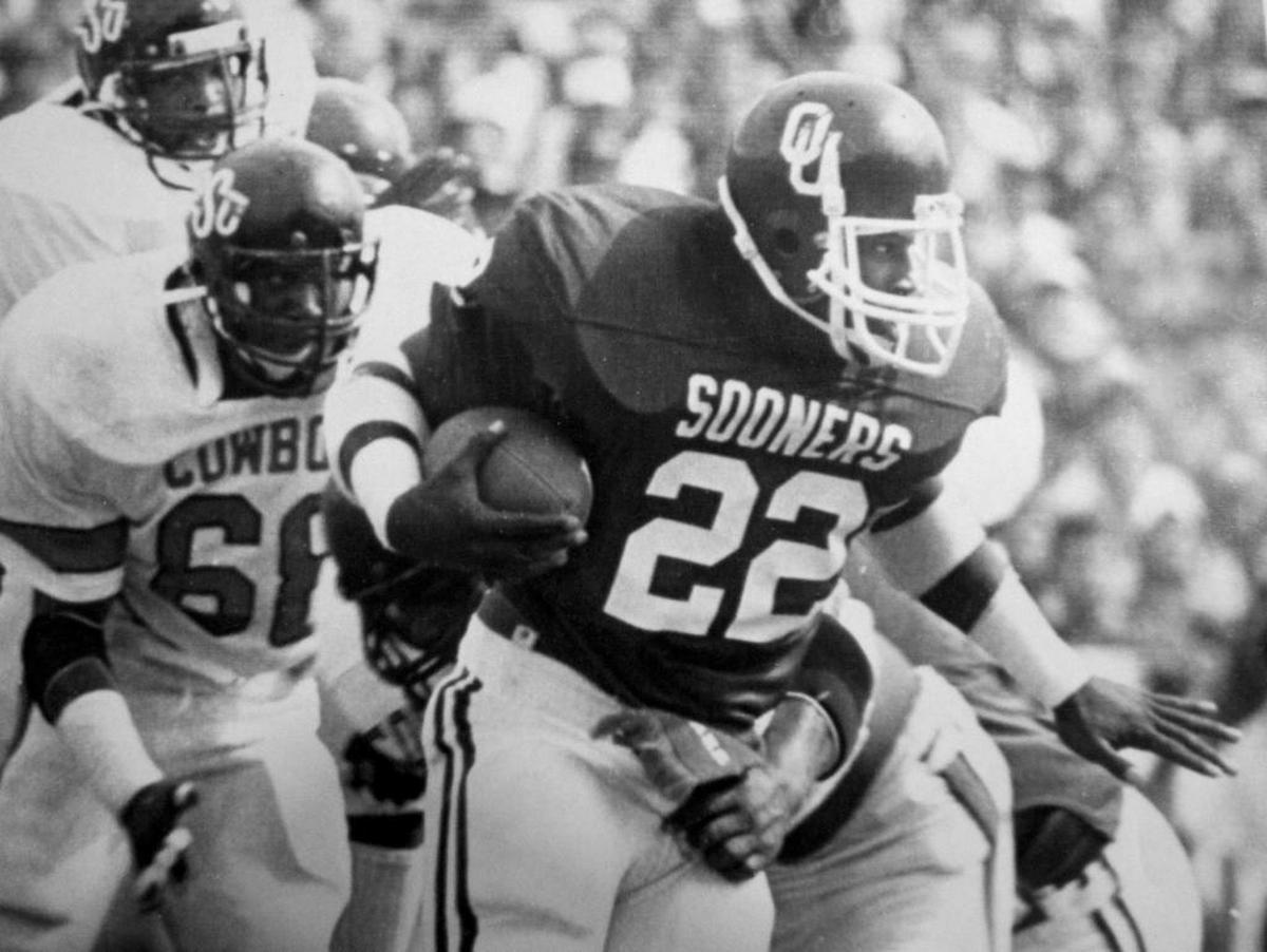 Oklahoma tailback, Marcus Dupree, breaks through the Oklahoma State defense.