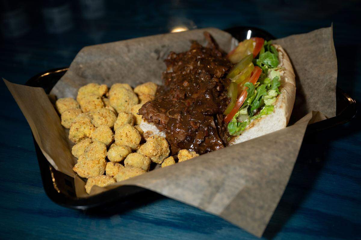 Pulled pork with fried okra at Boonies on the Bayou on Friday, Dec. 5, 2025.