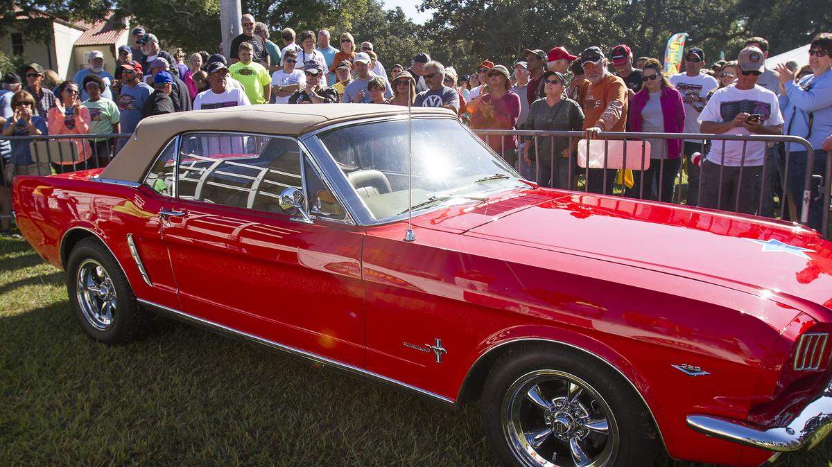 AMANDA McCOY/SUN HERALD 
 The Make-A-Wish Raffle Car for 2016 was unveiled on Sunday, October 11, 2015, at Cruise Central in Gulfport. Next year cruisers will have a chance to win the 1965 Mustange convertible.