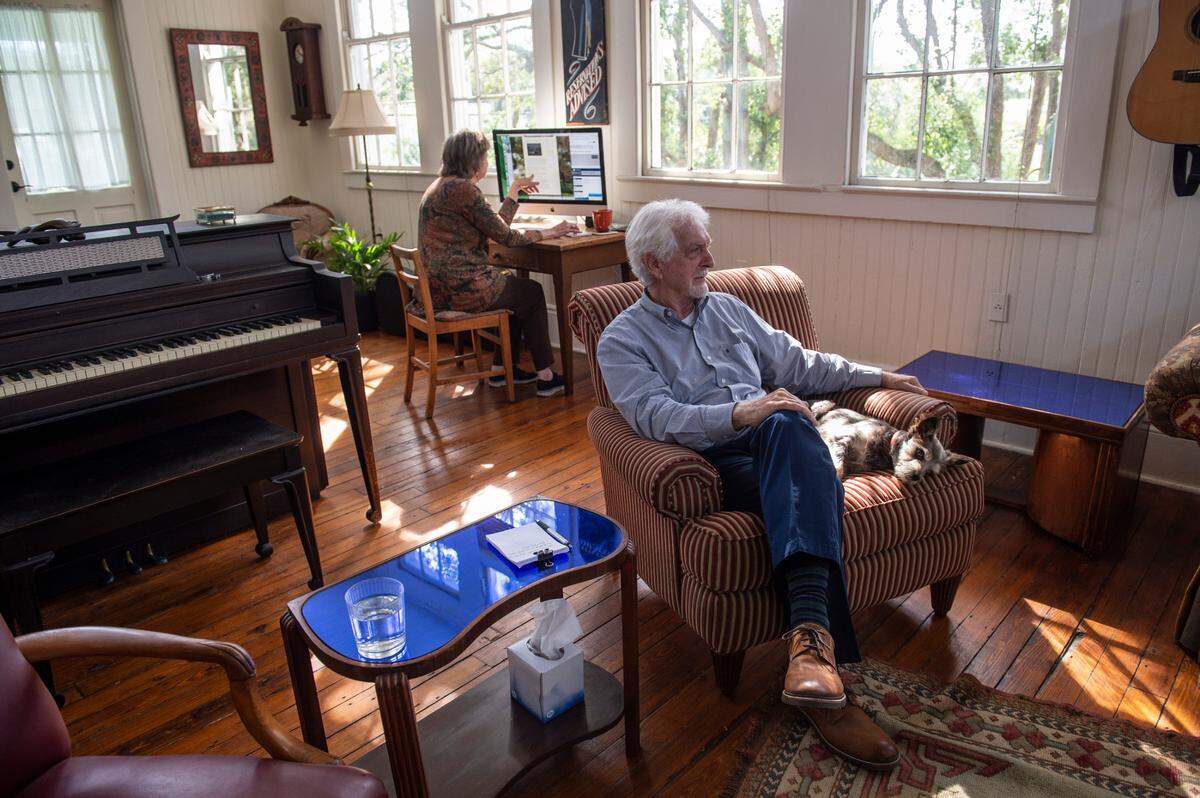 Current owners Ellis Anderson and Larry Jaubert, right, relax inside the living area in the former R.W. Webb School in Bay St. Louis on Wednesday, Nov. 3, 2021. The couple uses half of the house as their living space and rented out the other half of the house before the coronavirus pandemic.