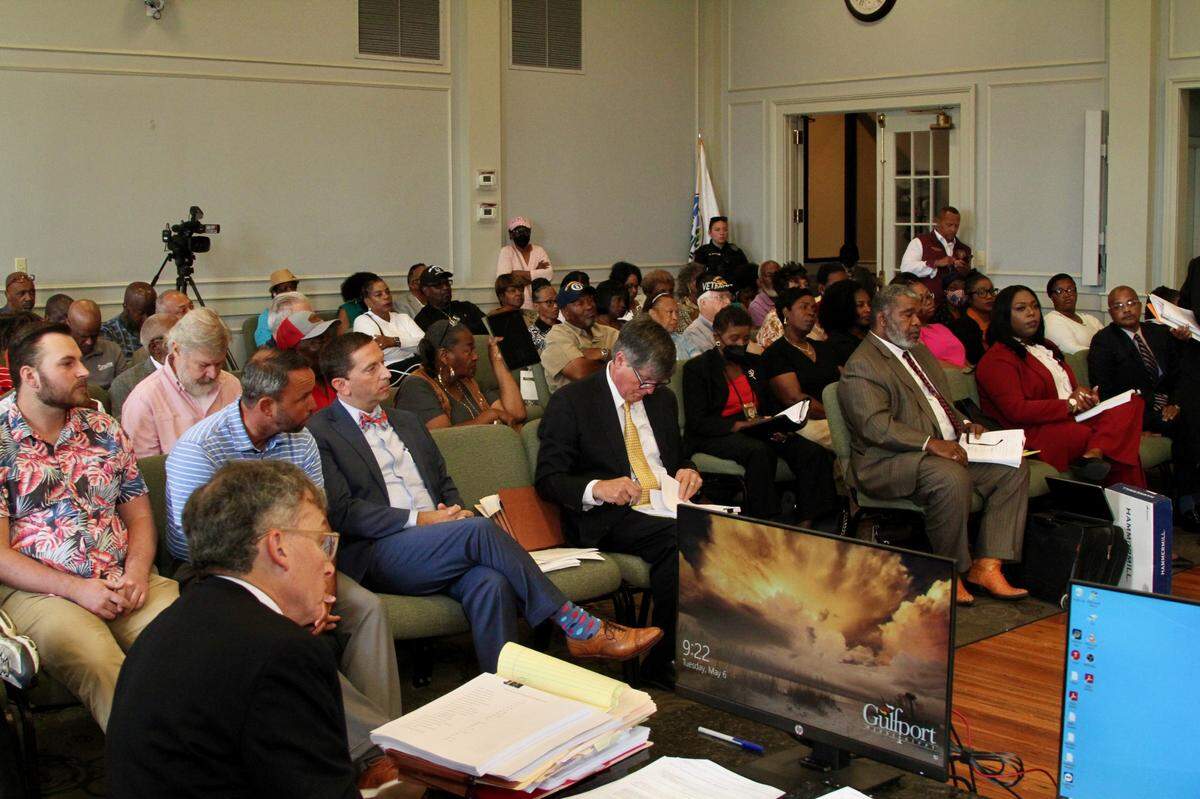 A full house attended an election challenge filed by Republican R.Lee Flowers, left in bow tie, against Democratic challenger Carrissa Corbett, front row right in cream blouse, over whether she can run June 3 for the Ward 6 City Council seat. Corbett prevailed in Flowers’ challenge over her residency.