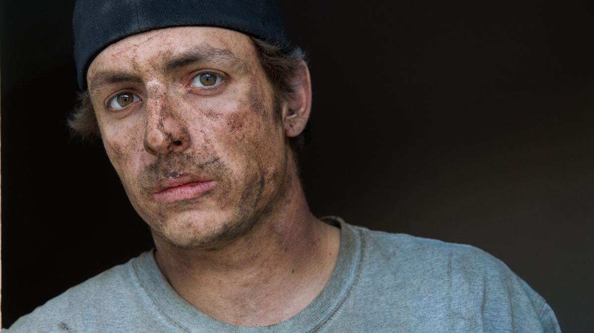 Andy Turco, 24, after returning to his apartment from a 12-hour shift on an oil rig south of Williston, N.D. Turco died from a heroin overdose after returning to Illinois when an oil glut led to a plunge in gas prices that indirectly put an estimated 250,000 global oil and gas employees out of work. (Zbigniew Bzdak/Chicago Tribune/TNS)