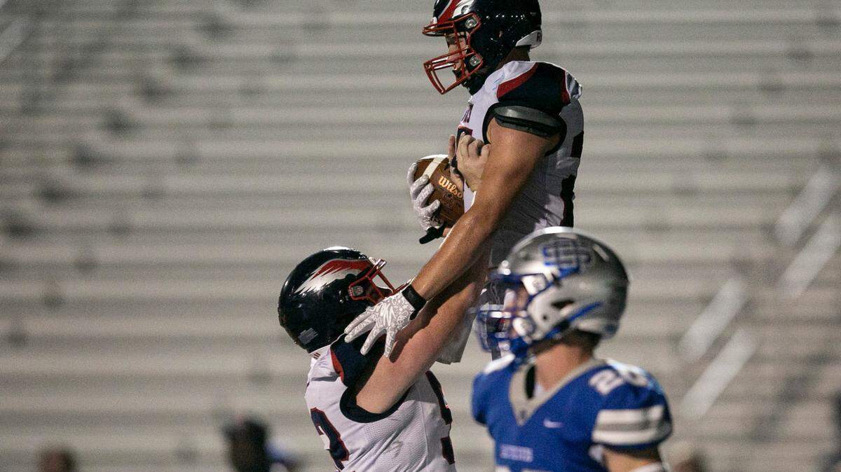 Hancock’s Cameron Miller, right, is hoisted in the air by a teammate after scoring a touchdown during the matchup between Ocean Springs and Hancock at Greyhound Stadium in Ocean Springs on Friday, Sept. 24, 2021.