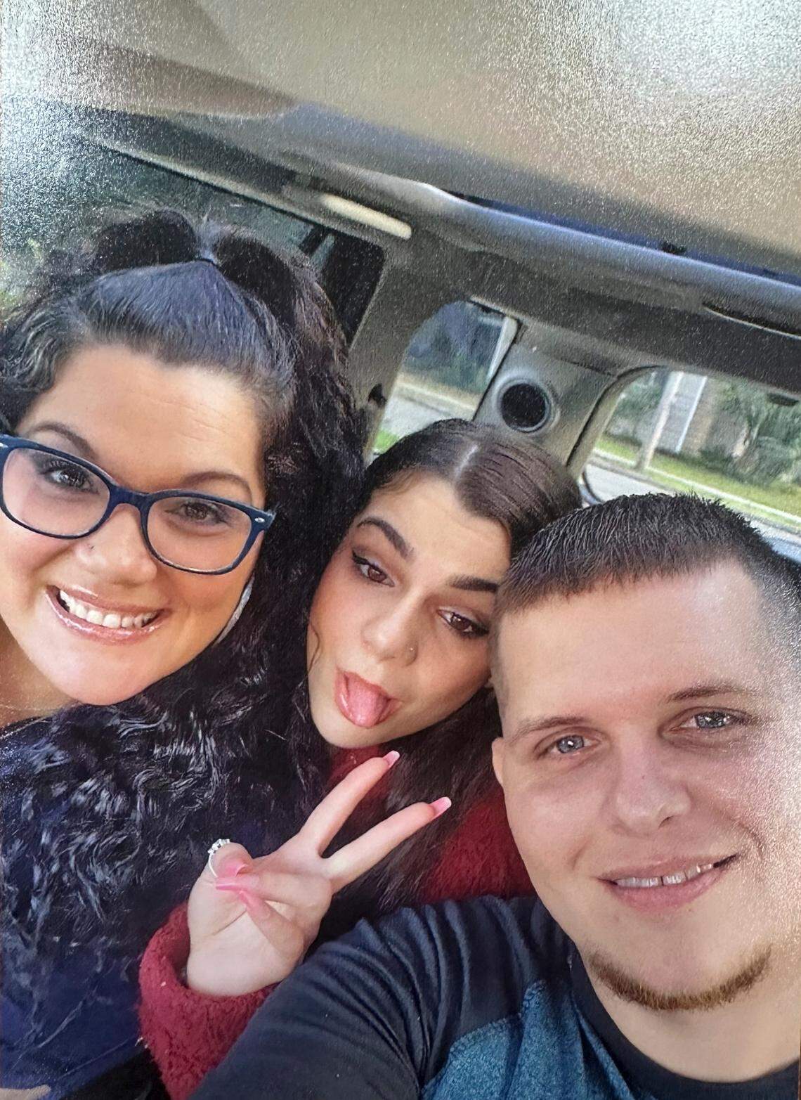 Kayelyn Drake, center, and her mother Viola Carter, left.