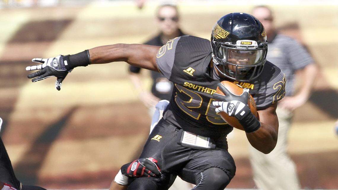 TIM ISBELL/SUN HERALD 
 Southern Miss running back Ito Smith will look to reach the 1,000-yard mark again in 2016. USM is stuck in Conference USA, but the right conditions could trigger a move to the American Athletic Conference.