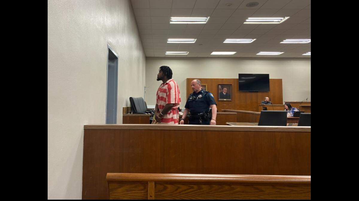 Jordin Earl Holmes is escorted out of a Harrison County Circuit Court courtroom after pleading guilty to sexually assaulting an 8-year-old girl. He initially tried to blame the child for the crimes.