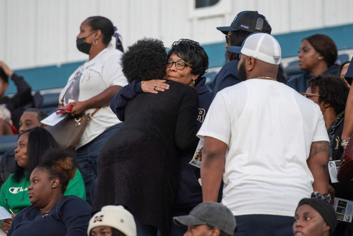 Kyla Watkins’ grandmother, Carole Robinson, hugs family members as family, friends and community members arrive for a candlelight vigil in honor of three Gautier High School graduates at Gautier High School in Gautier on Thursday, Dec. 7, 2023. Se’Dhari Saniya Watson-Person, Kyla “Muffin” Watkins, and Tatyanna Richmond were involved in a fatal crash on Tuesday, leading to the deaths of Watson-Person and Watkins.