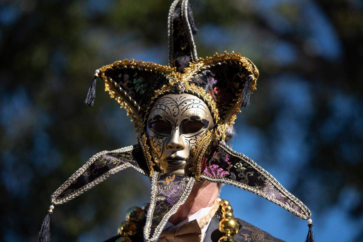 A float rider wears a mask during the Gulf Coast Carnival Association’s Mardi Gras parade in Biloxi on Tuesday, Feb. 13, 2024.