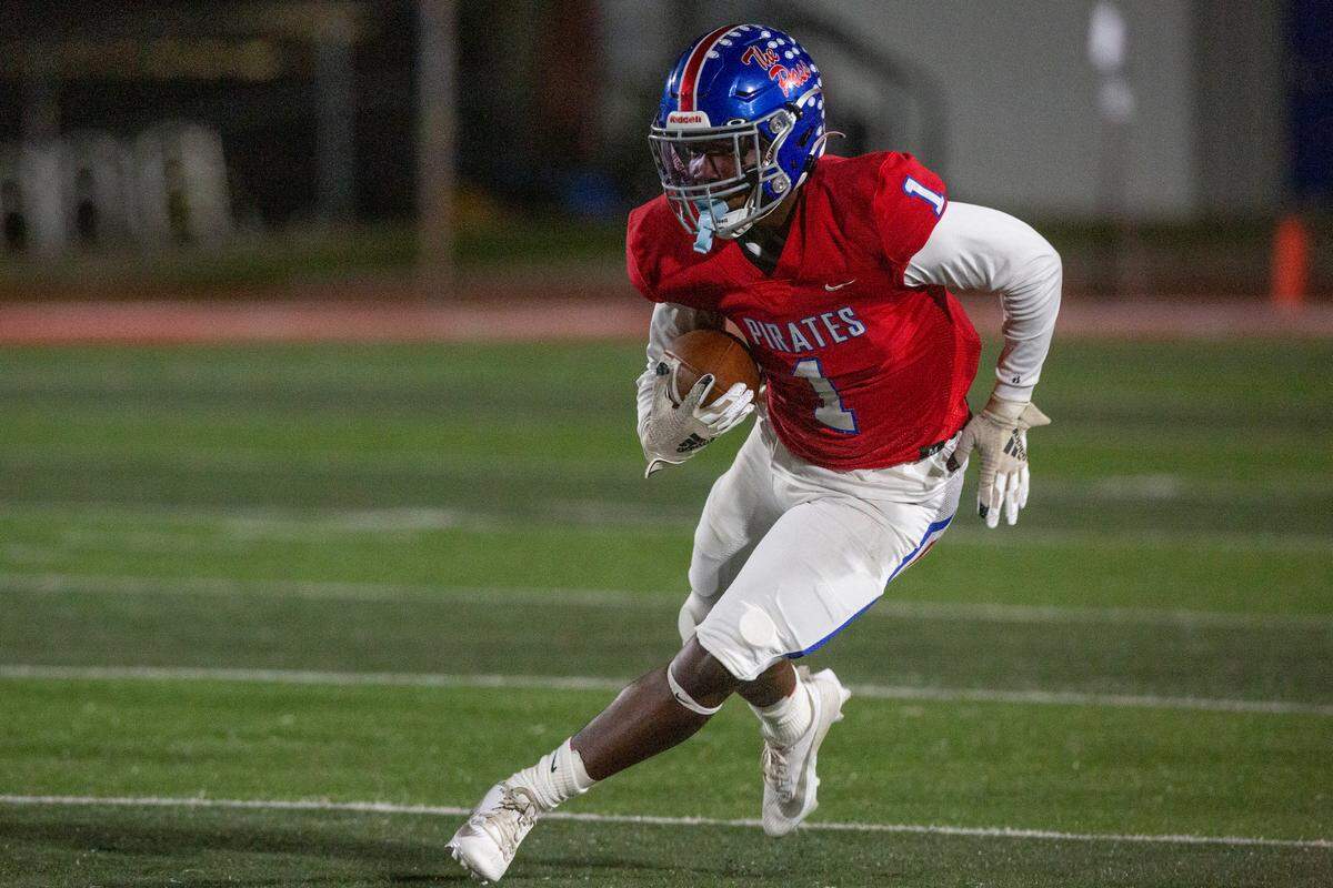 Pass Christian’s Terry Patton runs the ball down the field during a game against Moss Point at Pass Christian High School in Pass Christian on Friday, Oct. 13, 2023.