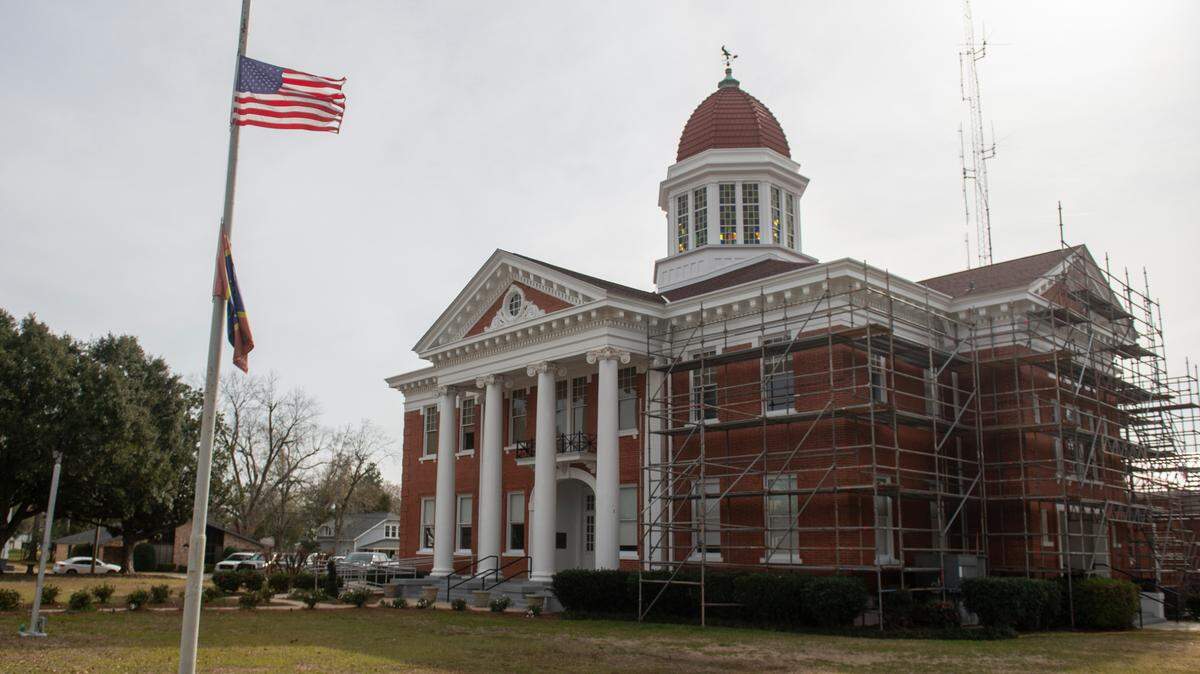A flag flies at half-staff outside administrative buildings in Lucedale on Jan. 5, in honor of Jeremy Malone, an officer with the George County Sheriff’s Department that was killed on Thursday.