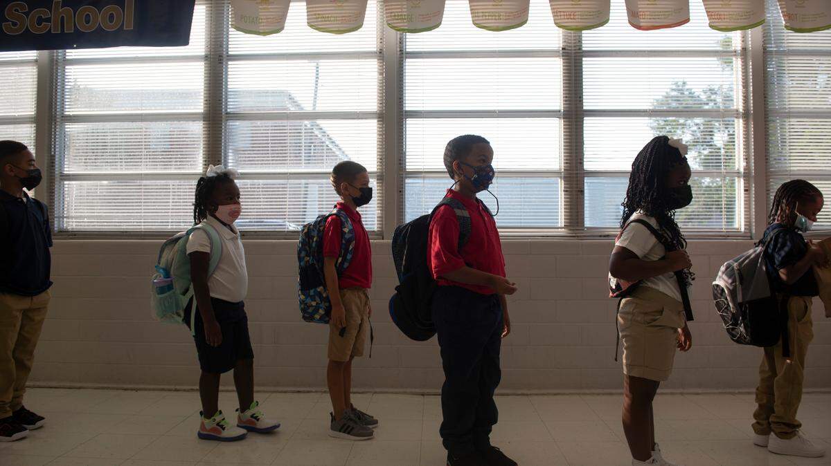 Students at Gautier Elementary wait in line for free breakfast on the first day of school on Monday, July 5, 2021. All students get free breakfast but have to eat it in their homeroom class due to the COVID-19 pandemic.