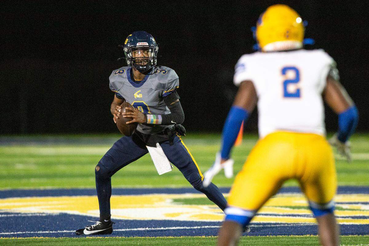 Gautier quarterback Trey Irving looks to throw a pass during a 5A playoff game between Gautier and Natchez at Gautier High School on Friday, Nov. 15, 2024.