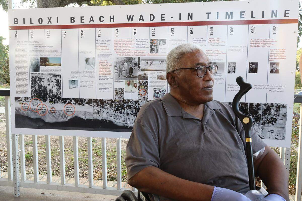 Dr. Gilbert Mason Jr. is pictured at the 2020 Biloxi Wade-In remembrance with a plaque that was installed on the beach with a timeline of the wade-ins. He was 5 at the first wade-in protest with his father, Dr. Gilbert Mason Sr.