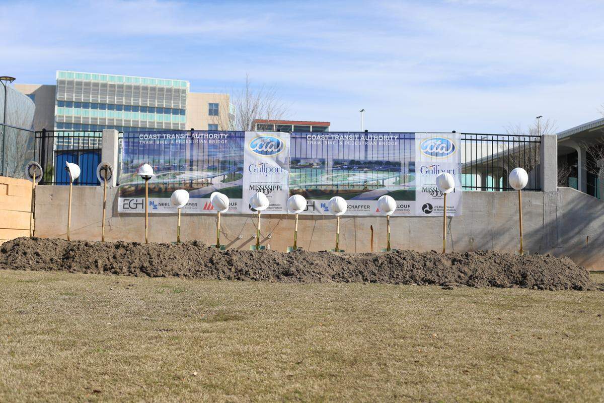 Officials break ground on an $18 million tram bridge that will connect Jones Park to the Mississippi Aquarium in Gulfport on March 21, 2022.