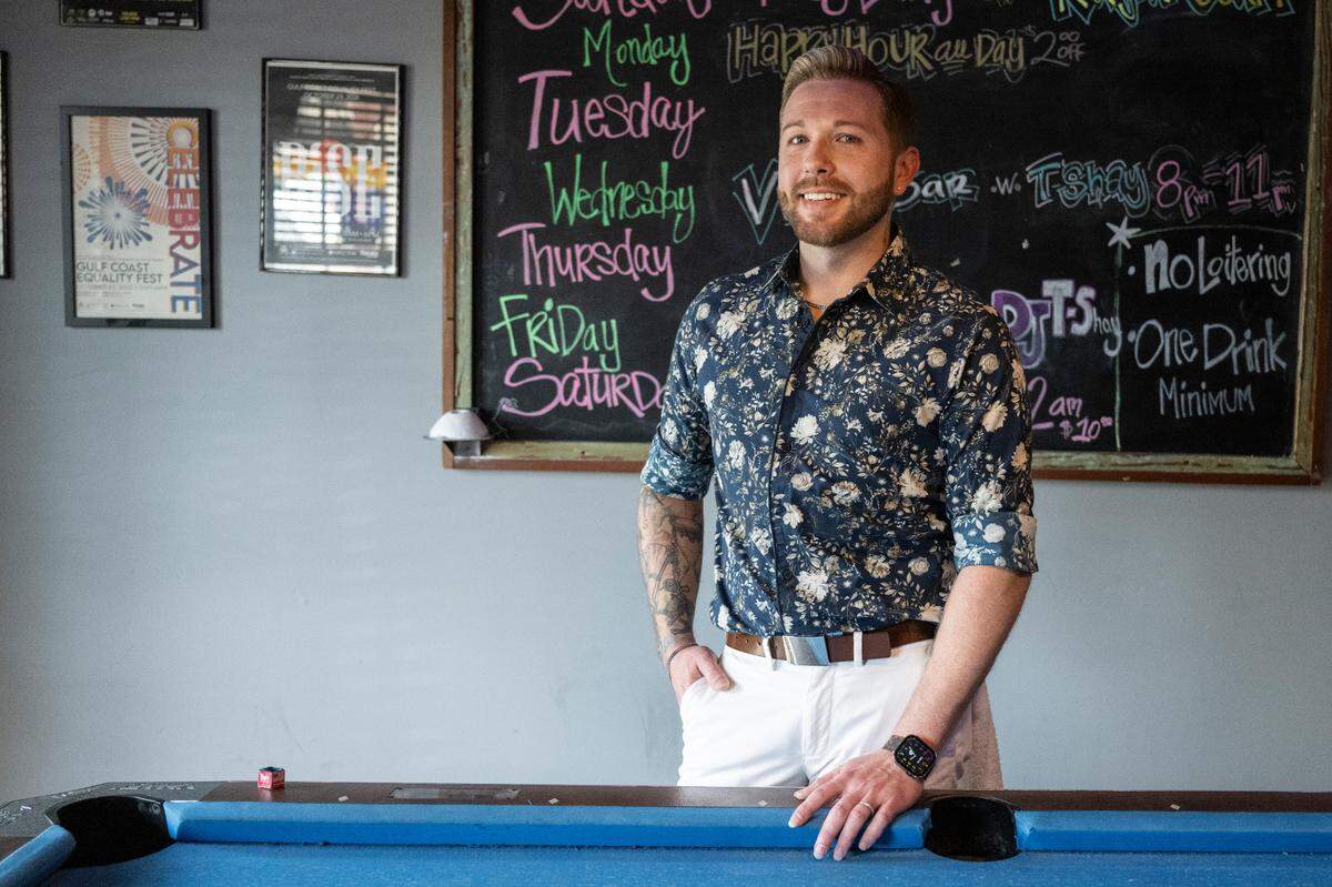Kyle Simmons, a bartender at Sipps Bar in Gulfport, poses for a photo at the bar on Tuesday, June 24, 2025.