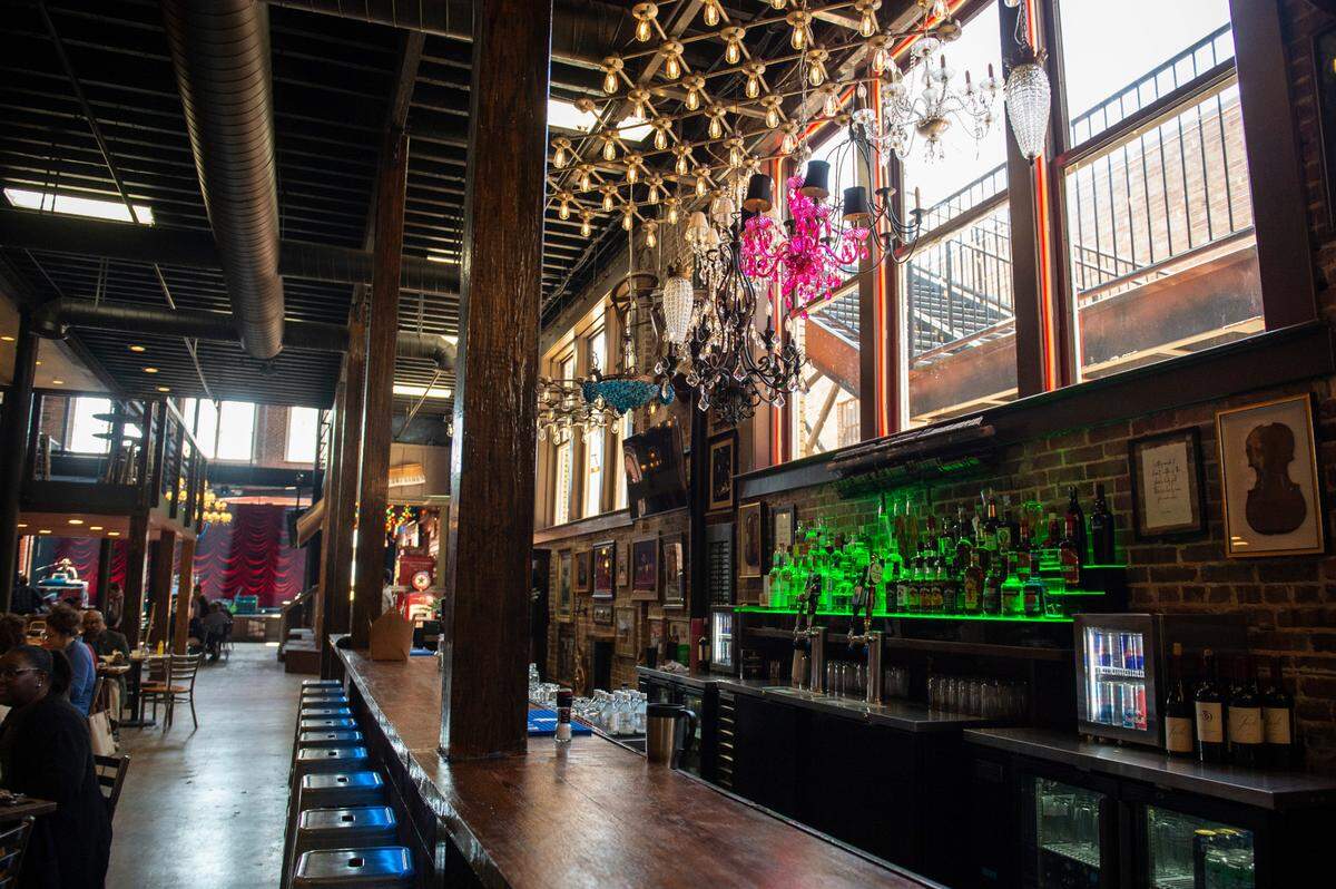 Chandeliers hang over the main bar at Ground Zero Blues Club in Biloxi on Thursday, Feb. 10, 2022.