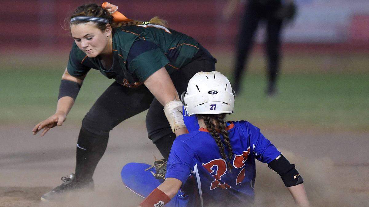 CHRIS TODD/SPECIAL TO THE SUN HERALD 
 West Harrison's Rebecca Cuevas (left) tags out Neshoba Central's Alyssa Wilkinson on Thursday, May 12, 2016, the first day of the 2016 MHSAA Fast-Pitch Softball State Championships at Freedom Ridge Park in Ridgeland.