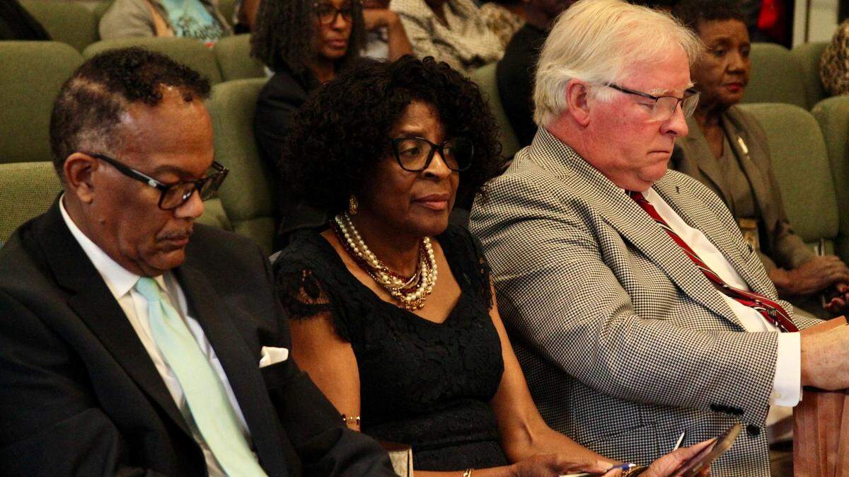Incumbent Ward 3 City Council member Ella Holmes-Hines, front center, sits with her attorney Tim Holleman, right, and husband Merlon Hines during a challenge to her eligibility as a candidate heard Wednesday by the Gulfport Municipal Election Commission. Holmes-Hines won the Democratic primary and has no challenger in the general election.