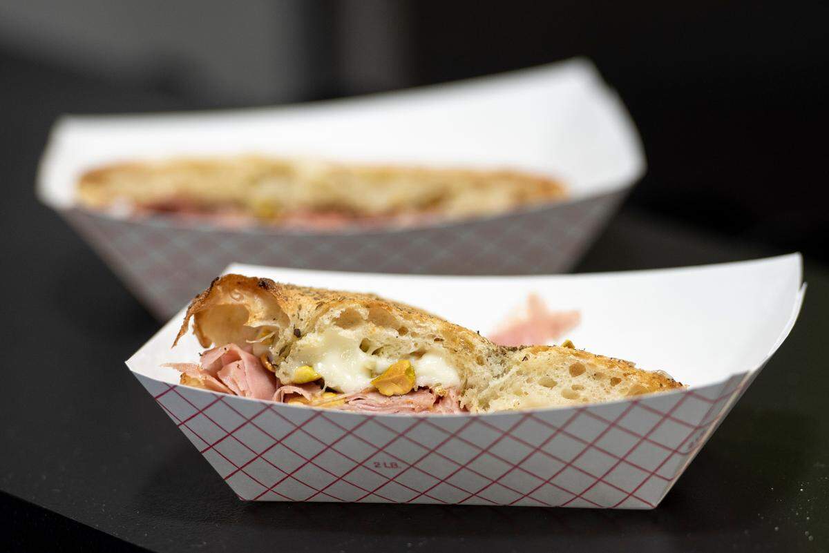 The Rome sandwich contains mortadella, stracciatella, crushed pistachios and hot honey, at Tavi’s Salumeria in Gulfport.