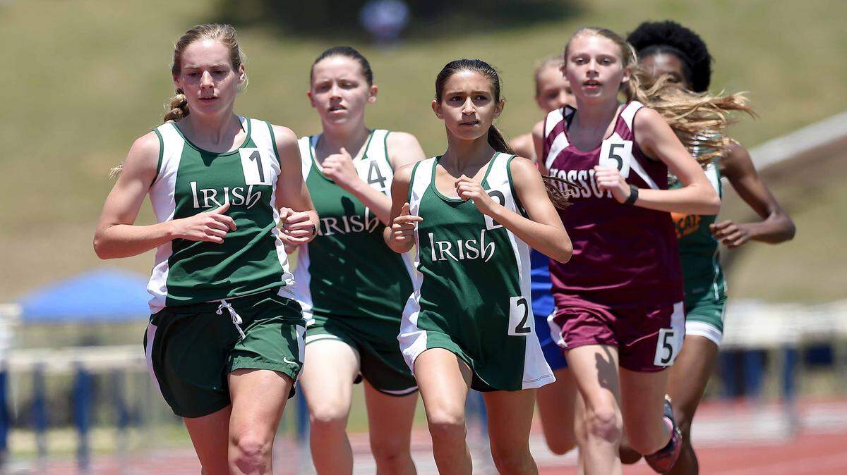 CHRIS TODD/SPECIAL TO THE SUN HERALDSt. Patrick's Ramsey Wagner and teammates Isabel Leatherman (2) and Jordan Pete (4) lead the field in the Class 3A 3,200-meter which they would eventually win Saturday, at the MHSAA Class 1A-3A-5A State Track Championships at Pearl High School. Wagner won four medals, the Lady Irish finished overall.