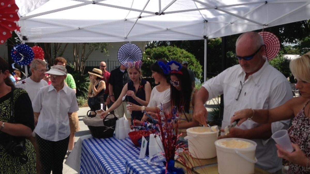 COURTESY OCEAN SPRINGS CHAMBER OF COMMERCEGuests enjoy blueberries, strawberries and ice cream at a past Red, White and Blueberry Festival.