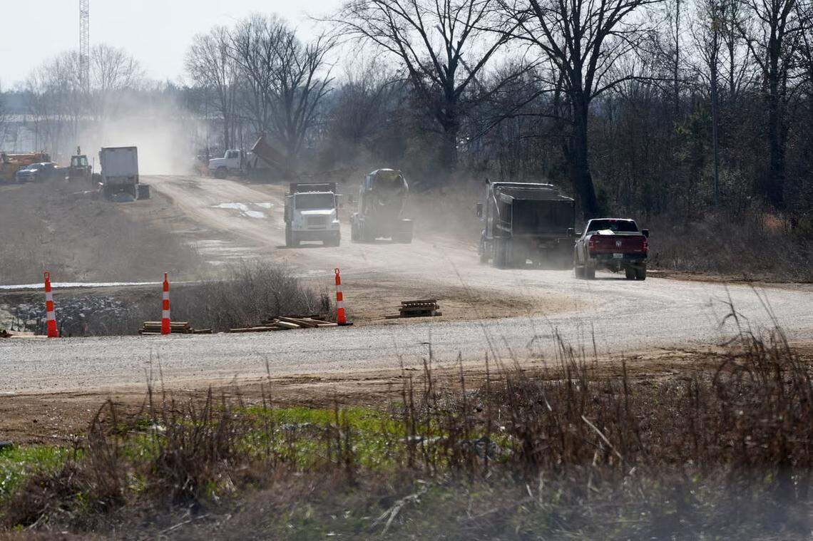 A line of traffic raises clouds of dust near Amazon’s data center campus on the outskirts of Canton. Construction on the complex is still ongoing, and some news outlets have reported that the site will be completed by summer of 2027.