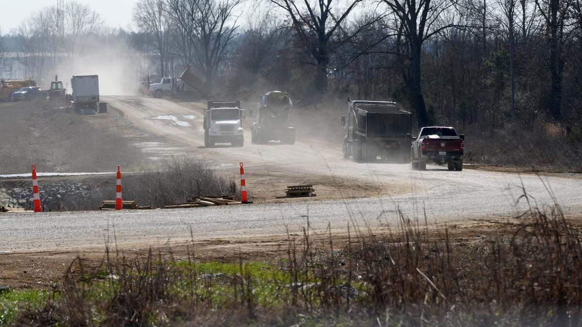 A line of traffic raises clouds of dust near Amazon’s data center campus on the outskirts of Canton. Construction on the complex is still ongoing, and some news outlets have reported that the site will be completed by summer of 2027.