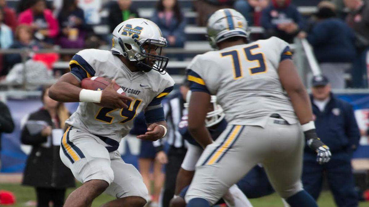 BILL BARKSDALE/SPECIAL TO THE SUN HERALD 
 Gulf Coast Bulldog Ge'Vonte Jones (24) ran six times for 17 yards in the first half of the MACJC State Championship at Northwest Community College behind the blocking of D'Marcus Hayes (75).