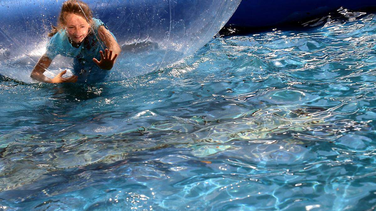 AMANDA McCOY/SUN HERALD/FILEKamille Rawlins of Biloxi treads water during one of the many activities for children at the Pine Hill Festival in 2011. This year's Pine Hill Festival in downtown Wiggins opens at 5 p.m. Friday, 10 a.m. to 7 p.m. Saturday and 10:30 a.m. to 3 p.m. Sunday.